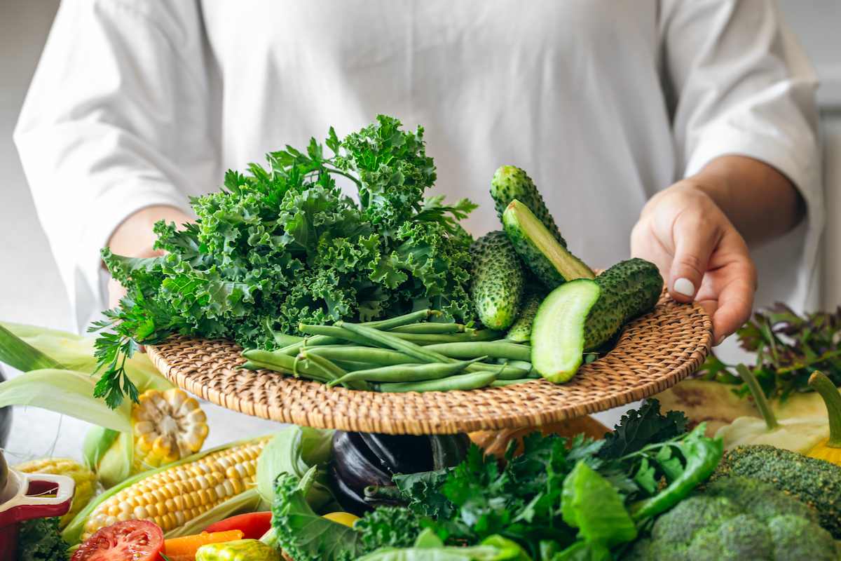 a-woman-holds-a-plate-with-cucumbers-kale-parsle-2025-03-14-00-49-34-utc (1).jpg